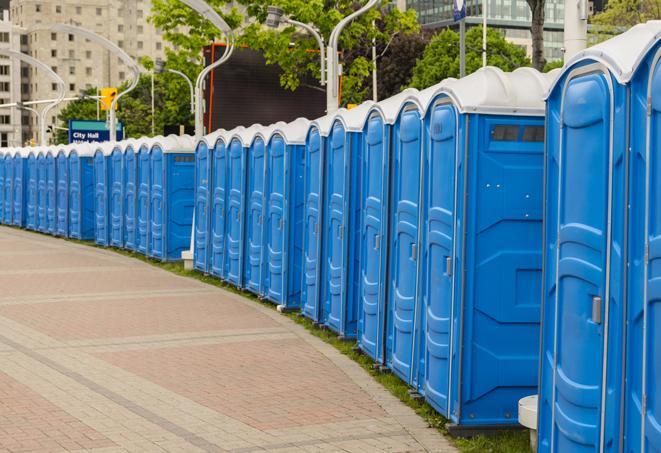 a row of sleek and modern portable restrooms at a special outdoor event in Claymont, DE